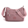 Lotus pink nylon crossbody bag with multiple zippered pockets and wide shoulder strap - Flesh Pink
