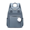 Zaino grigio-blu in tessuto Oxford con zip argentate e ciondolo pompon bianco - Blu