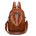 Caramel brown PU leather backpack with multi-pocket design and silver hardware - Caramel color