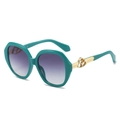 Lunettes de soleil ovales turquoise avec verres dégradés violets et détails dorés - Monture Verte Verres Double Gris