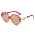 Oval sunglasses with pink to orange gradient frame and golden geometric M detail - Purple Frame Champagne Lens
