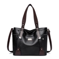 Bolso tote grande de cuero negro con asas marrones y elegantes detalles de borlas - Negro