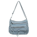 Sac bandoulière en denim bleu clair avec plusieurs poches zippées et sangle - Bleu clair