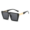Classic oversized square sunglasses with black frames and gold metal temples in 45-degree view - Black Frame Grey Lens