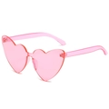 Lunettes de soleil cœur sans monture rose translucide avec un design monobloc élégant - Standard / Standard (verres roses)