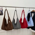 Minimalist large-capacity shoulder tote bags in four solid colors displayed on a rack - Light Blue