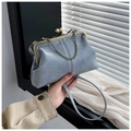 Light blue vintage shell bag with metal frame and chain handle in soft natural light - Blue