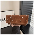 Detail of brown suede handbag featuring silver studs and delicate metal chain strap - Brown