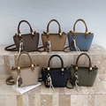 Mini trapezoid leather tote bags in various colors with woven charms and gold hardware - Brown