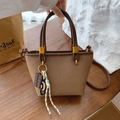 Deep khaki canvas tote bag with brown leather trim and shoulder strap in a retro style - Brown