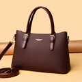 Elegant burgundy leather tote bag with diamond-embossed texture and gold hardware - Red