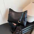 Sleek black hobo shoulder bag with adjustable strap and elegant gold hardware - Black