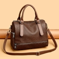 Close-up of dark brown woven leather texture and silver zipper detail on tote bag - Dark Brown