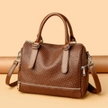 Detailed view of dark brown woven texture handbag with silver zippers and dual handles - Yellow Brown