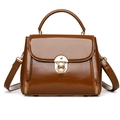 Polished caramel brown handbag with gold lock buckle and adjustable shoulder strap - Brown