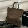 Vintage suede tote bag in brown featuring contrasting dark green leather handles - Green