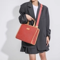 Red canvas tote bag with brown leather trim and adjustable pink shoulder strap - Red