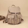 Detail view of khaki pebbled leather backpack with drawstring closure and front flap pockets - Khaki