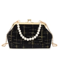 Elegant black velvet shell bag with gold lattice pattern and pearl handle on white background - Black