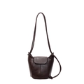 Retro chocolate brown bucket bag with adjustable strap and flap closure in a clean studio view - Brown