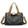 Front view of a charcoal canvas tote bag with khaki webbing handles and adjustable shoulder strap - Black