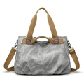 Retro grey canvas tote bag with brown straps and detachable shoulder strap on white backdrop - Gray