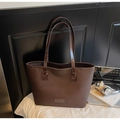 Deep brown faux leather tote bag with long shoulder straps and minimalist brand label - Brown