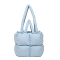Light blue quilted nylon puffer tote bag with handles for shoulder or hand carry - Blue