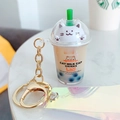 Sleutelhanger met drijfzand bubble tea, witte kat en kleurrijke laser polsband decor - Melkthee Kleur