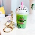Creative matcha green cat-themed milk tea keychain with liquid sand and gold ring - Green