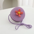 Close-up of woven lavender straw bag featuring a red checkered fabric flower detail - Diameter 12cm / Purple Round Bag with Red Flower