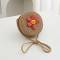 Close-up of circular straw woven bag for kids with red plaid flower and thick shoulder strap - Diameter 12cm / Khaki Round Bag with Red Flower