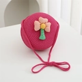 Detail of rose red woven kids crossbody bag with 3D fabric flower and spiral texture - Diameter 15cm / Rose Red Round Bag with Pink Flower