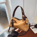 Detail of matte suede Boston bag with wooden bead charm and golden hardware rings - Basic Style / Brown