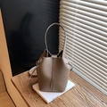 Minimalist grey leather bucket bag with litchi texture and adjustable shoulder strap - Gray