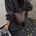 Classic dark brown pebble leather bucket bag for women with elegant gold-tone hardware - Brown