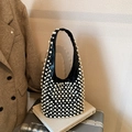 Fashionable black faux leather underarm bag with decorative white pearls on a suitcase - Black