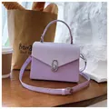 Lavender snake-print PU leather box bag with silver twist lock and elegant top handle - Purple