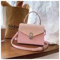 Pink snake-patterned PU leather square handbag with silver metallic twist lock closure - Pink