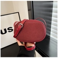 Minimalist dark red oval crossbody bag in premium matte texture with adjustable strap - Red