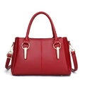 Dark red lychee pattern leather handbag with gold metal accents and shoulder strap - Burgundy