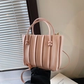 Pink pleated handbag with spherical handle accents and a detachable shoulder strap - Pink