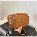 Brown oval crossbody bag with matte suede texture and adjustable leather strap - Brown