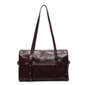 Deep brown leather Boston bag with decorative buckle and silver zipper on white background - Coffee Large