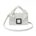 White snake pattern faux leather handbag with knot handle and black buckle detail - White