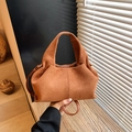 Fashionable caramel suede cloud bag with integrated handle for crossbody use - Brown
