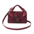 Burgundy faux snakeskin crossbody bag with knotted handle and black square buckle - Red