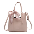 Pink lychee textured crossbody bag with decorative scarf handle and shoulder strap - Pink