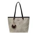 Greyish green tote bag with matte texture, black handles and brown furry charm - Khaki and Black With Charm