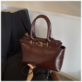 Classic dark brown glossy leather handbag with elegant gold buckle and top handle straps - Brown